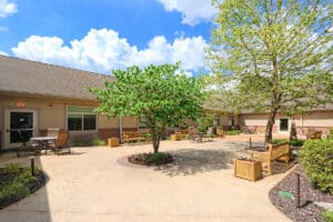 Outside courtyard with seating, trees and flower boxes