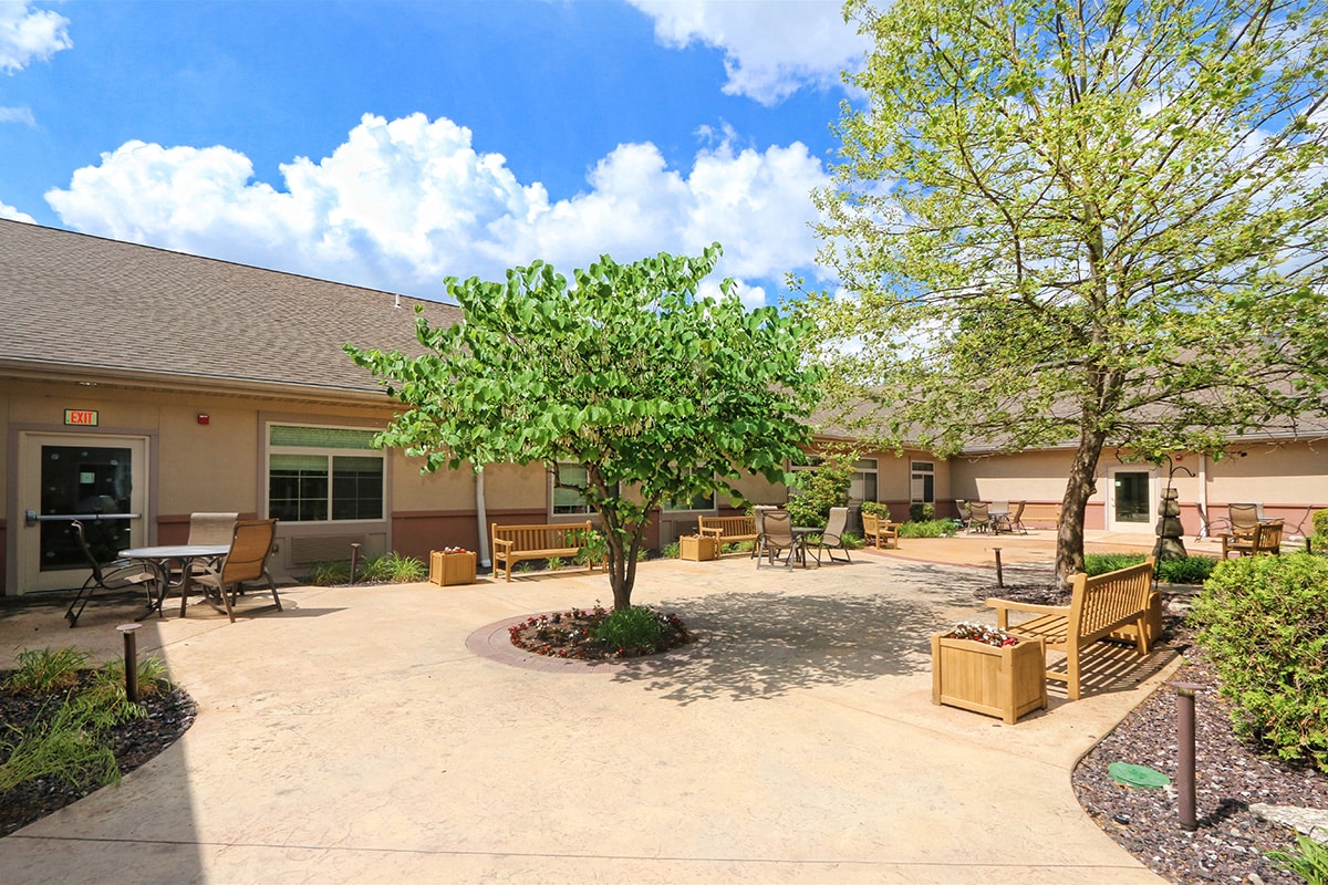 Outside courtyard with seating, trees and flower boxes