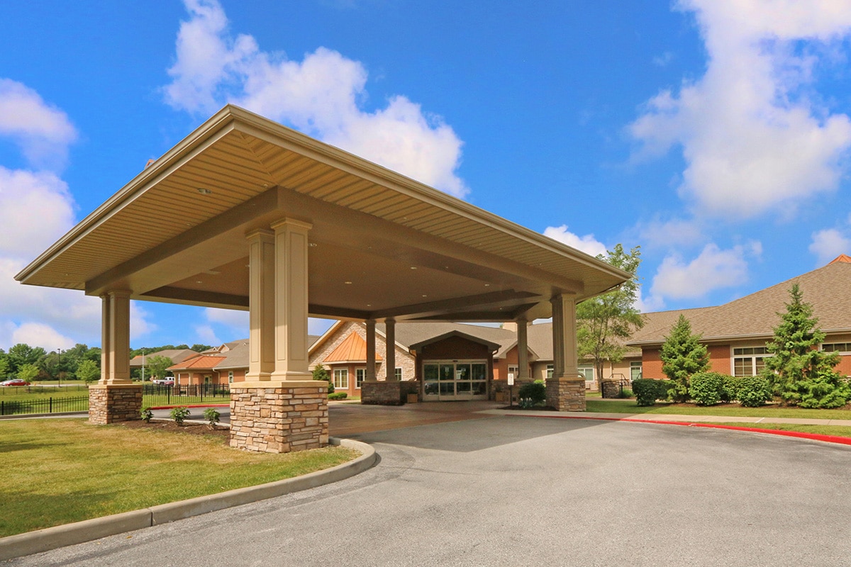 Front of facility with covered driveway to entrance