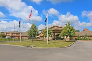 Front of facility with green belt in front