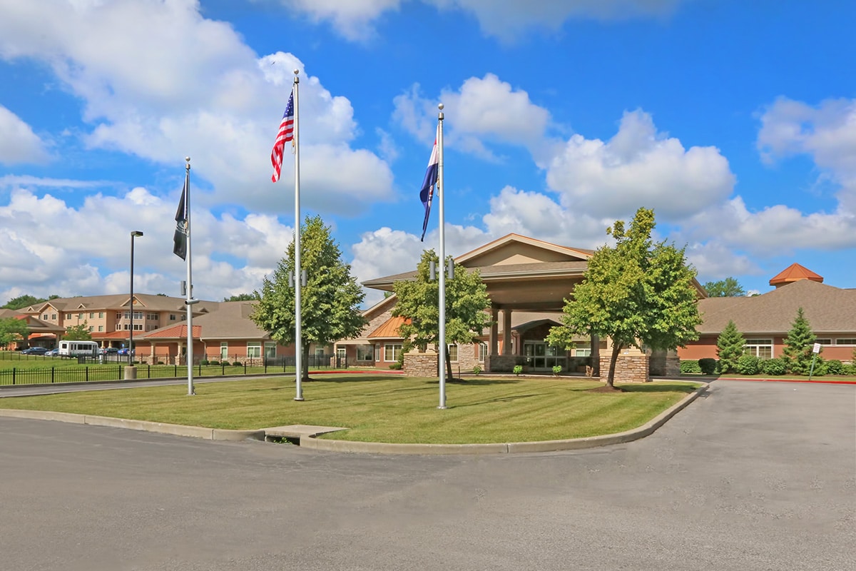 Front of facility with green belt in front