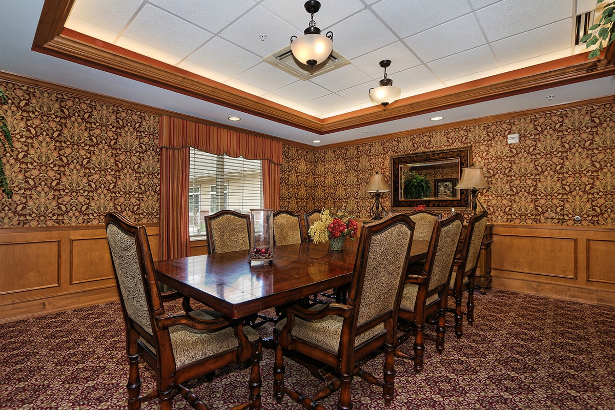 Dining room with mahogany table and high back chairs