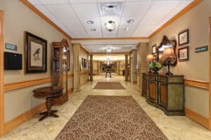 Hallway with beautiful rugs and art work on the walls