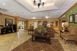 Lobby with comfortable furniture and wide double doors at the entrance