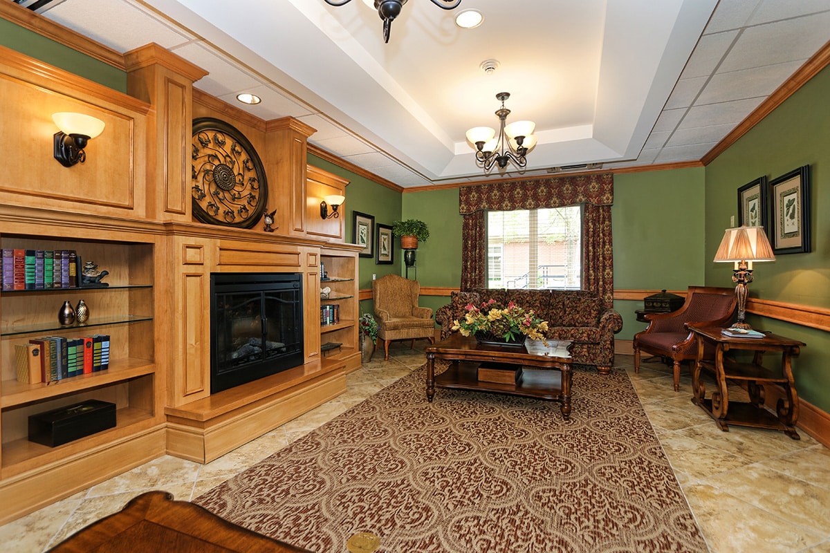 Lobby with fireplace and bookshelf of books
