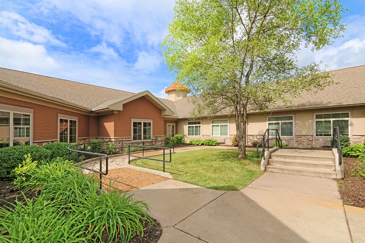 Courtyard of facility with ramp to entrance of building